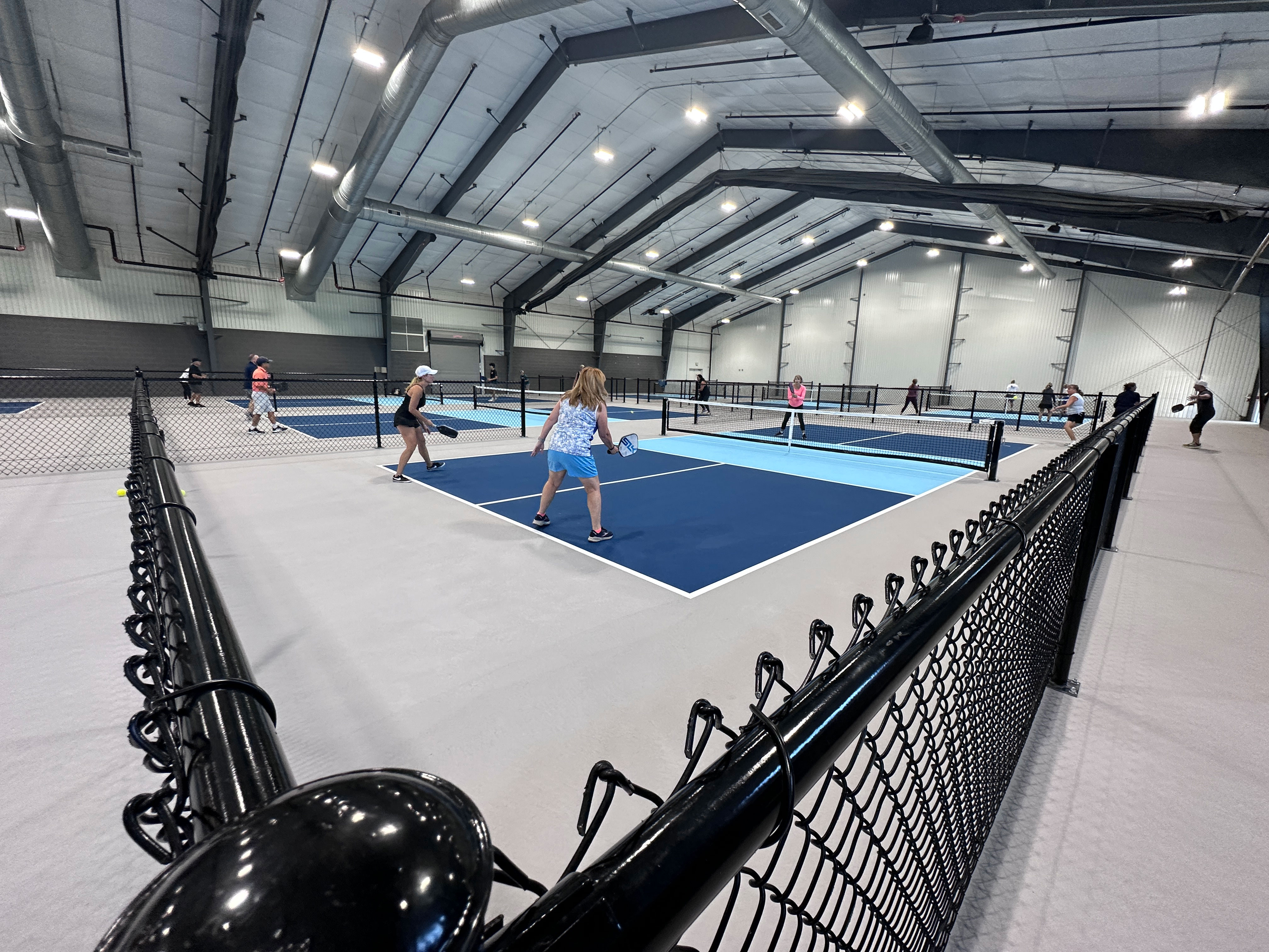 Players on the courts at The Pickle Factory